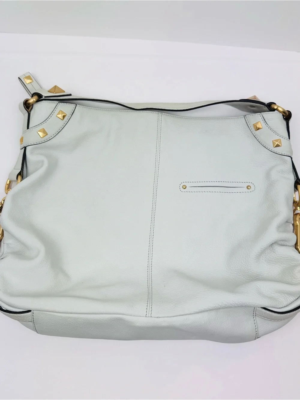 B. Makowsky Leather Ivory Hobo handbag. Gold-tone stud accent hardware.
